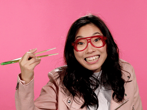 Actor/Comedian Awkwafina smoking a joint held with chopsticks