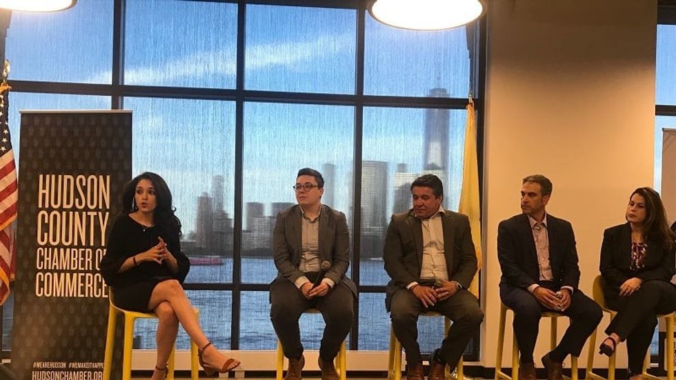 Gonzalez ( left) speaks at the Hudson County NJ Chamber of Commerce on marijuana reform