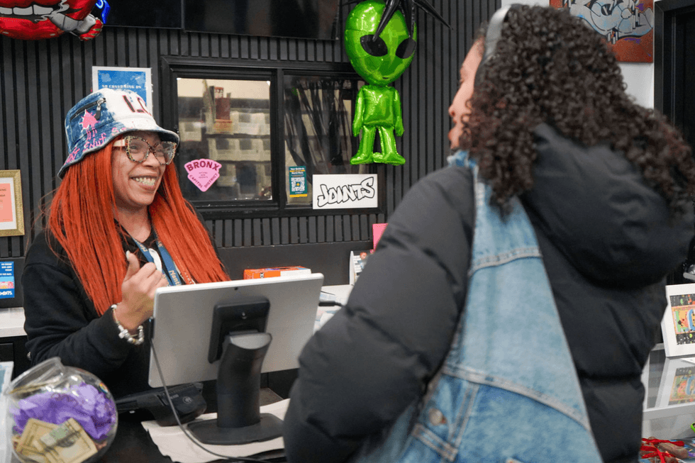 image of a budtender serving a customer at ConBud Yankee Stadium