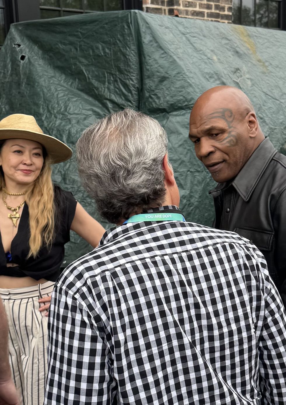 image of Iron Mike Tyson arriving at Revelry Buyers Club, in the photo is Lulu Tsui, founder of On the Revel and Mike Tyson