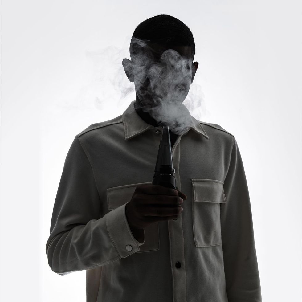 man holding Puffco Peak Pro