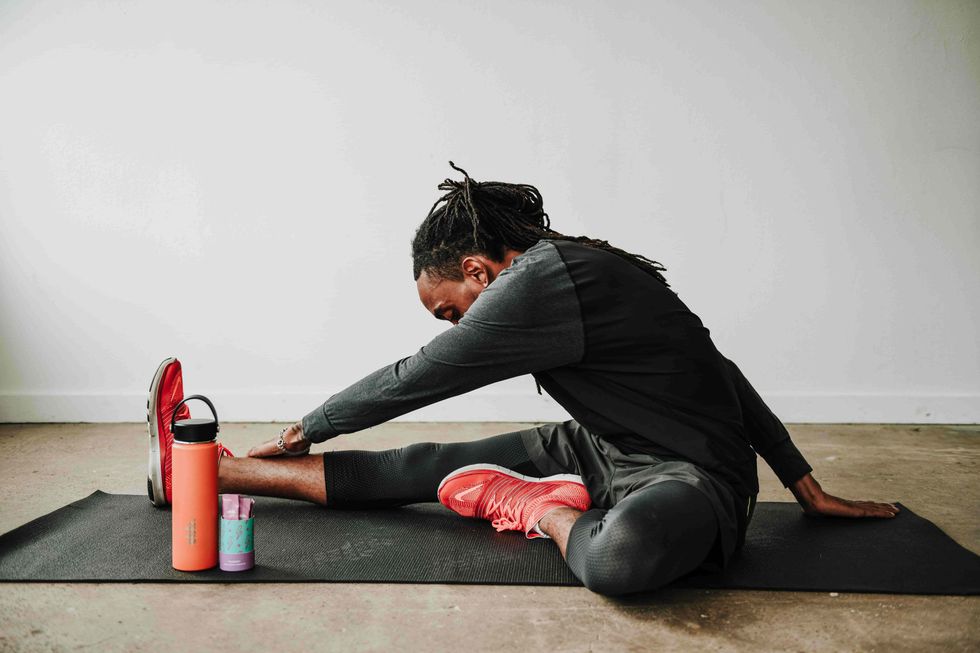 man stretching next to ebb