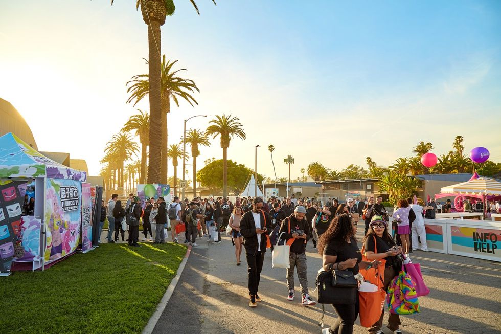 Mixed crowd walking around at outdoor conference or festival