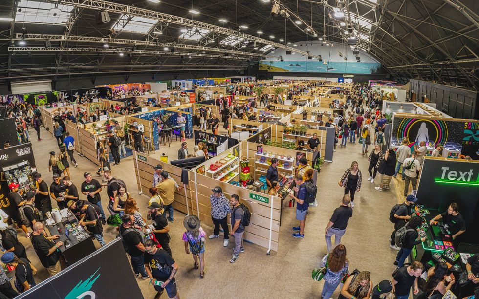 Overhead shot of Hall of Flowers conference - showing booths, vendors and attendees