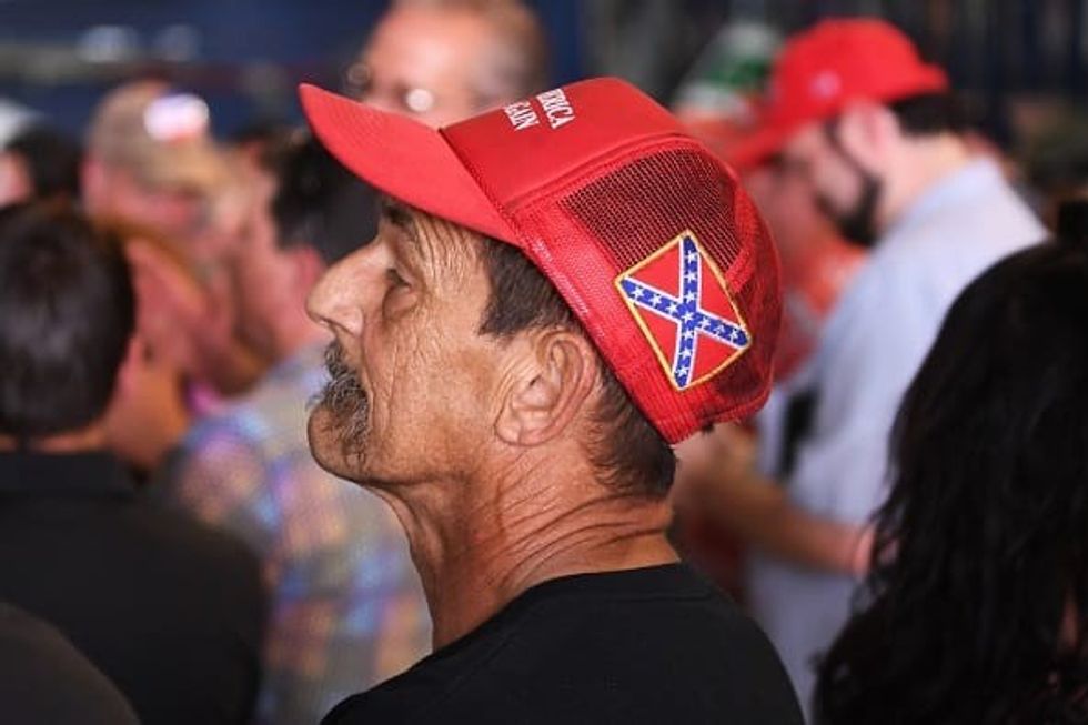 Trump follower listens closely to his leader's words at a recent rally