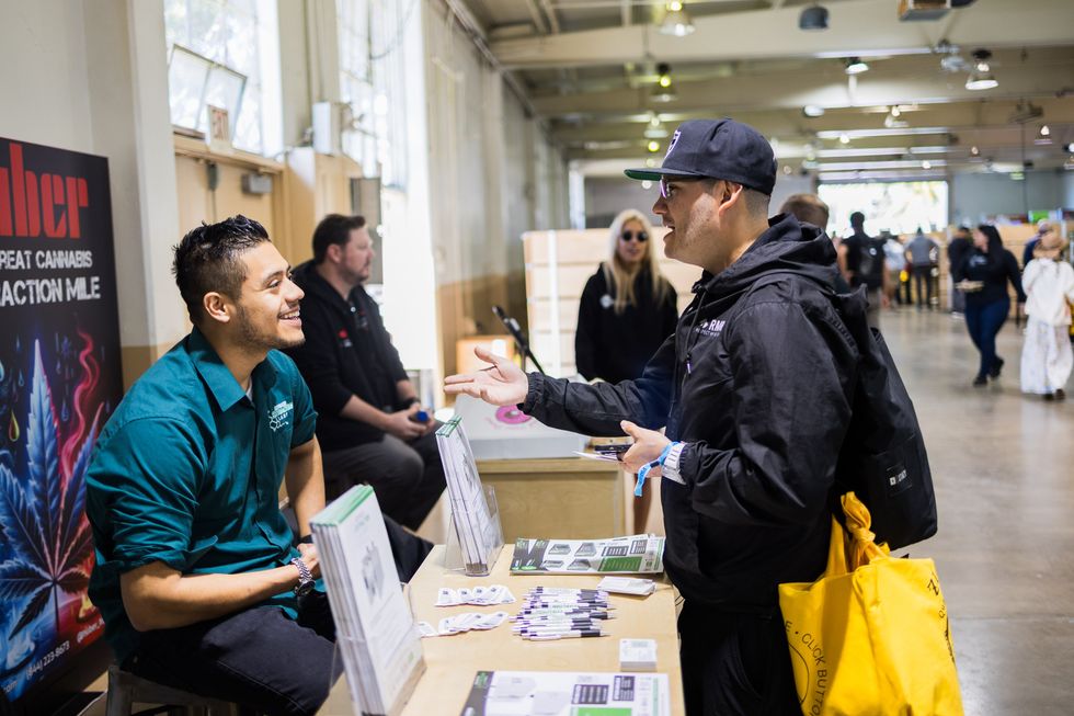 Two people talking at industry conference