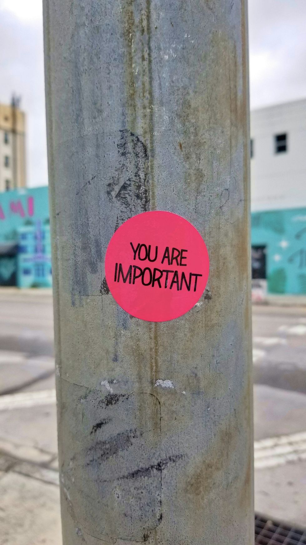 "you are important" sticker on lightpole; compliment